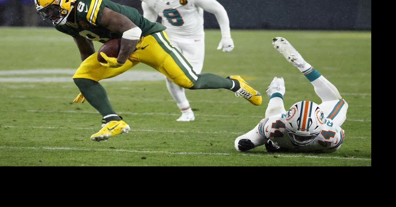 Love connects with Reed on 2 TDs as Packers use fast start to beat Dolphins 30-17