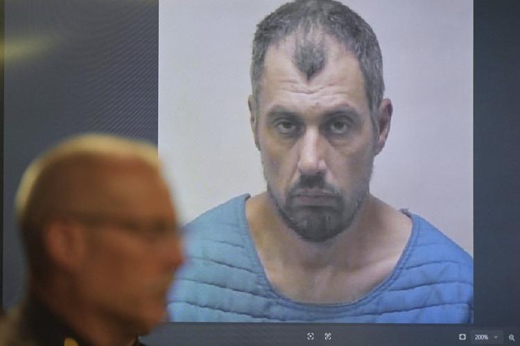 Suspect in Michigan Walmart stabbings is charged with a rarely used state terrorism count