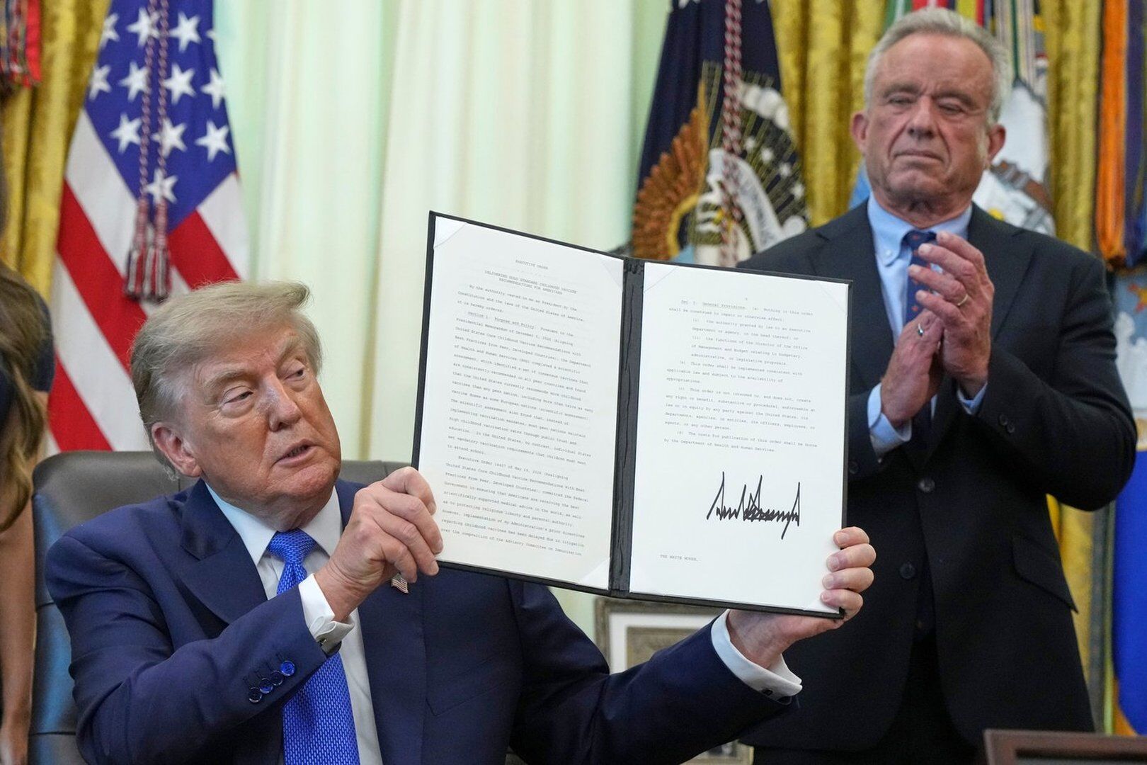 Trump signs executive order urging childhood vaccine revisions, falsely claims children required 72 jabs and MMR 'quite lethal'