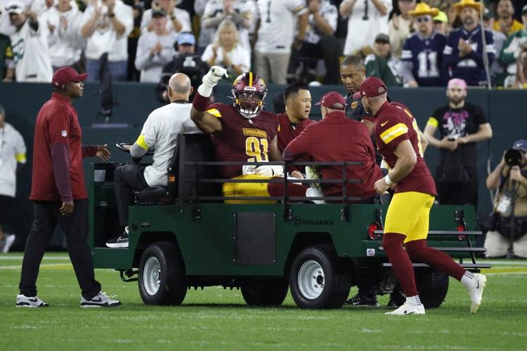 Commanders defensive end Deatrich Wise Jr. carted off the field with right leg injury vs. Packers