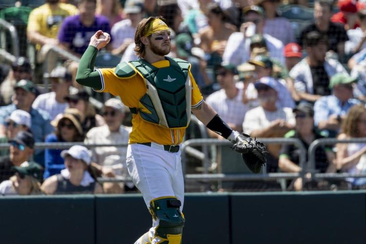 A's catcher MacIver gets go-ahead hit, throws out runner to end game in big league debut at age 28