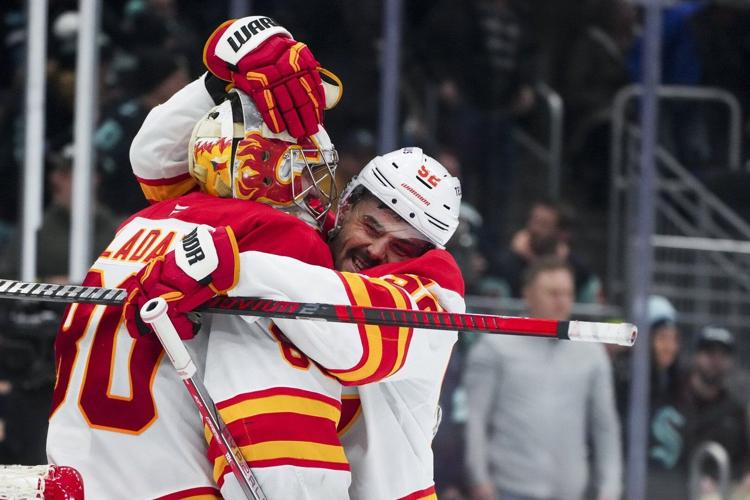 Flames score three times in first period, hang on to beat Kraken 3-2