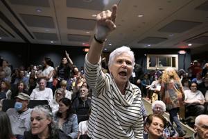 In New York, a GOP congressman is shelled with questions about Trump during raucous town hall