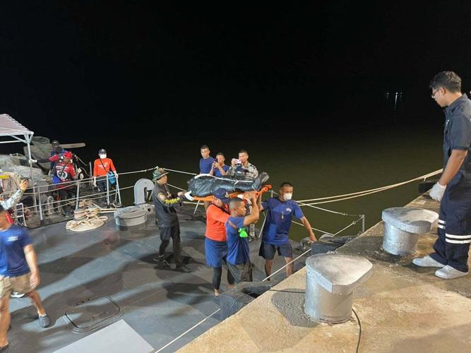 Rescuers searching for missing migrants after boat sinks off Malaysia recover 5 more bodies