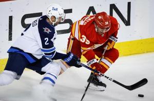 Flames rally from 3-1 deficit to ground Jets 5-4 in pre-season play
