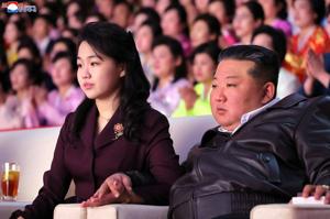 North Korean leader Kim and his daughter rides a tank together during army training