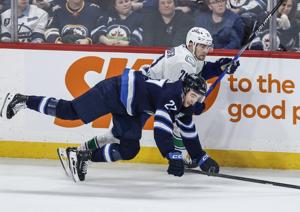 Morrissey scores in OT as Jets slip past Canucks 3-2