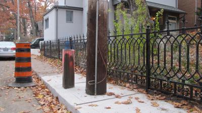 New utility poles on Hazel Ave. push people off the sidewalk