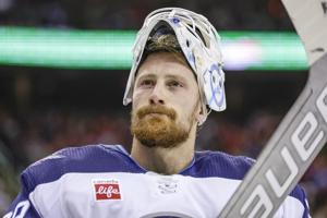 Blackhawks goaltender Brossoit will miss the start of training camp after knee surgery