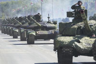 Serbia stages a large military parade to showcase tanks, jets and missile systems