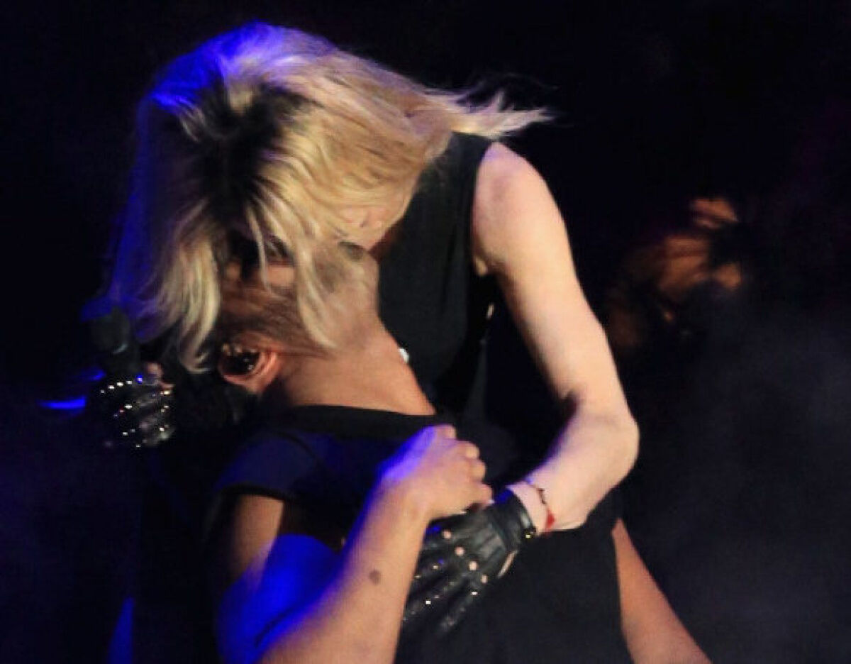 Madonna kisses her sex-goddess past goodbye Menon image