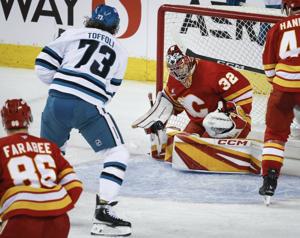 Flames still burning thanks to Sharangovich's new diet and big night