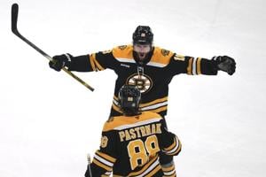 Pavel Zacha scores 2:15 into overtime and lifts the Bruins to a 3-2 win over the Red Wings