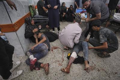 Photos show people mourning after airstrikes and shooting in Gaza overnight