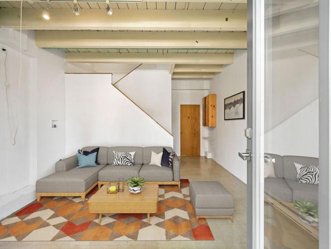 Inside this $980K ‘true hard loft’ townhouse in Toronto