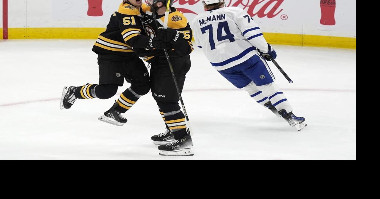 Marchand gets 1st goal of season in OT to lift Bruins to 4-3 win over Maple Leafs