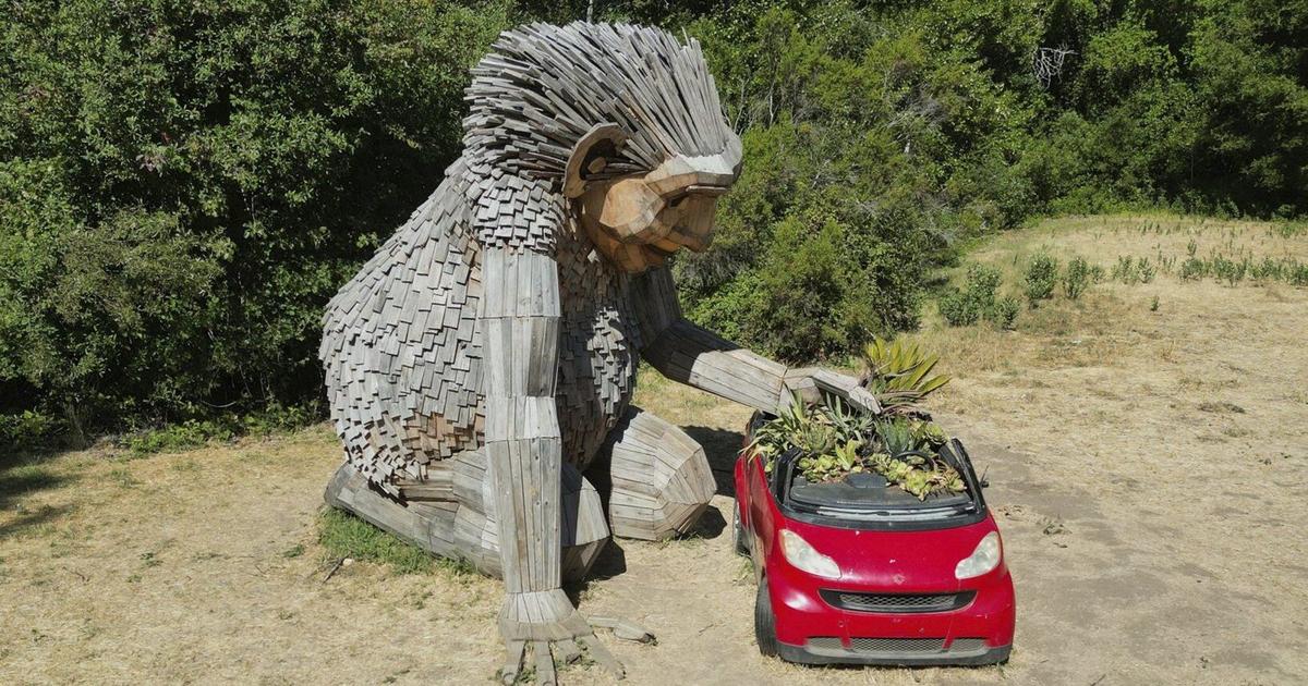 Giant trolls built from trash want to save humans from themselves
