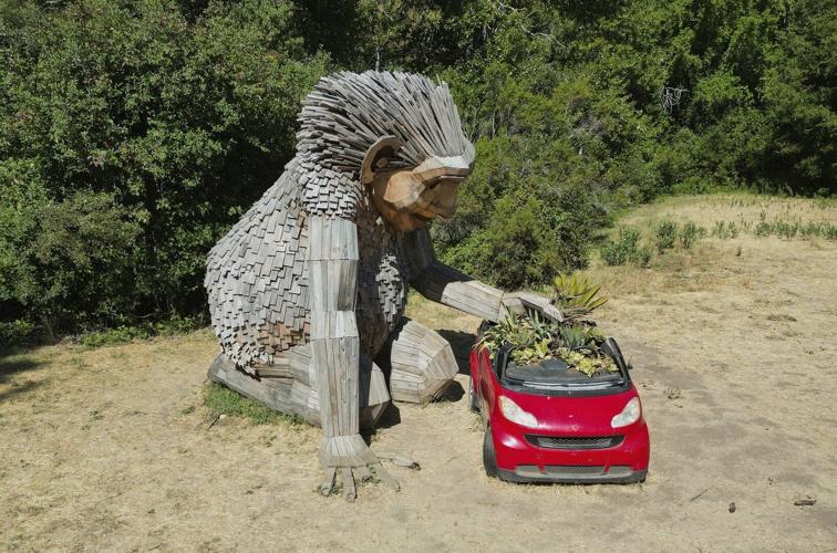 Giant trolls built from trash want to save humans from themselves