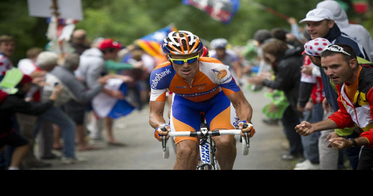 Tour de France Bradley Wiggins keeps yellow jersey, tacks on road play