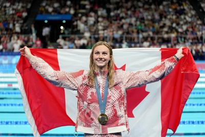 Canadian swimmer Summer McIntosh makes Olympic history with third gold medal