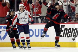 Timely 3rd-period goals from Hall, Walker keep Hurricanes in control of playoff win against Capitals