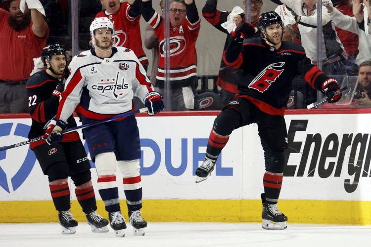 Timely 3rd-period goals from Hall, Walker keep Hurricanes in control of playoff win against Capitals