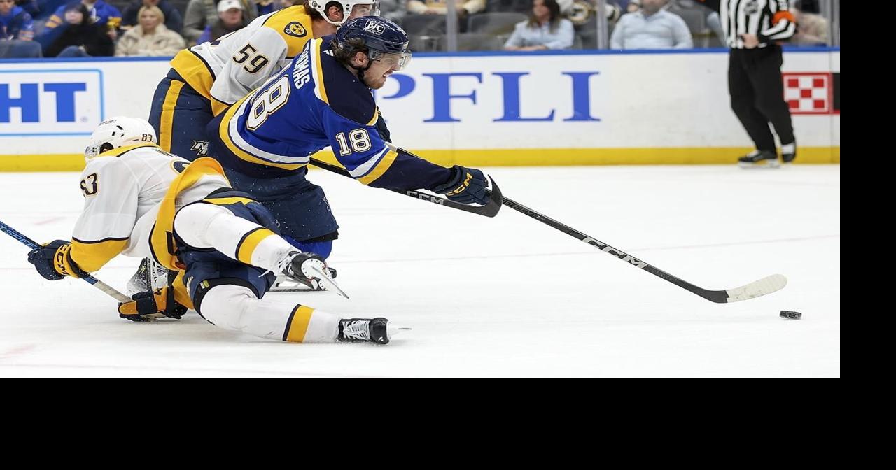 Thomas scores twice and the Blues beat the Predators 7-4