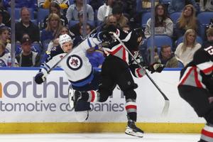 Jets use late surge to sink Sabres 5-2
