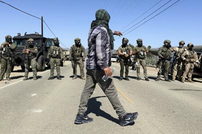 Protesters and federal agents clash during raid at Southern California farm