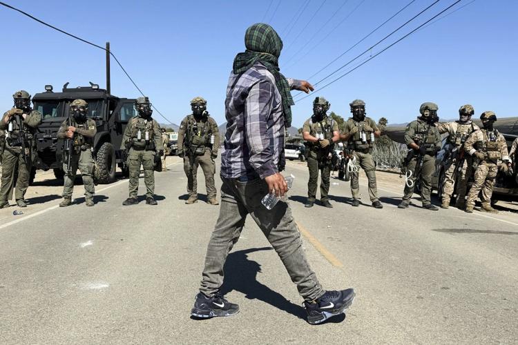 Protesters and federal agents clash during raid at Southern California farm