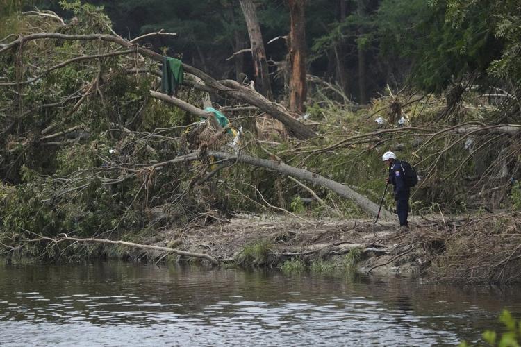 Emergency crews suspend search for flooding victims in central Texas amid new flood warnings.