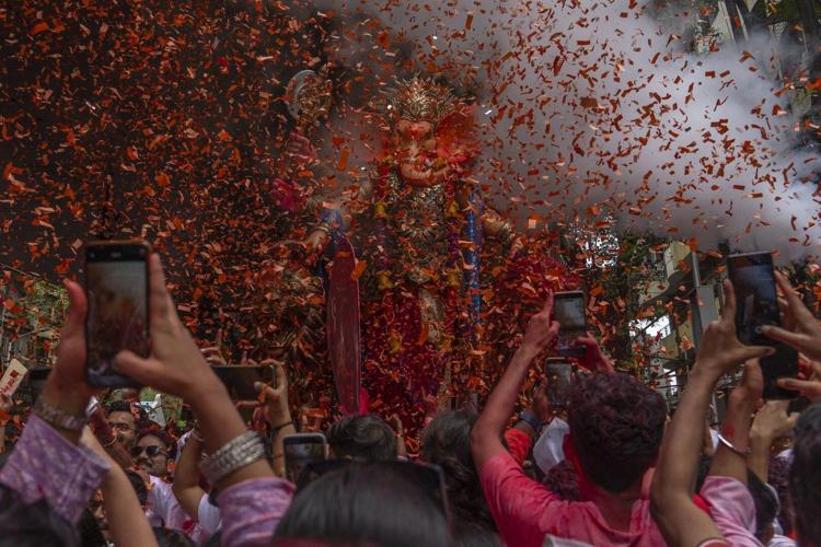 Photos show Indians marking final day of Ganesh Chaturthi that ends with sea immersion