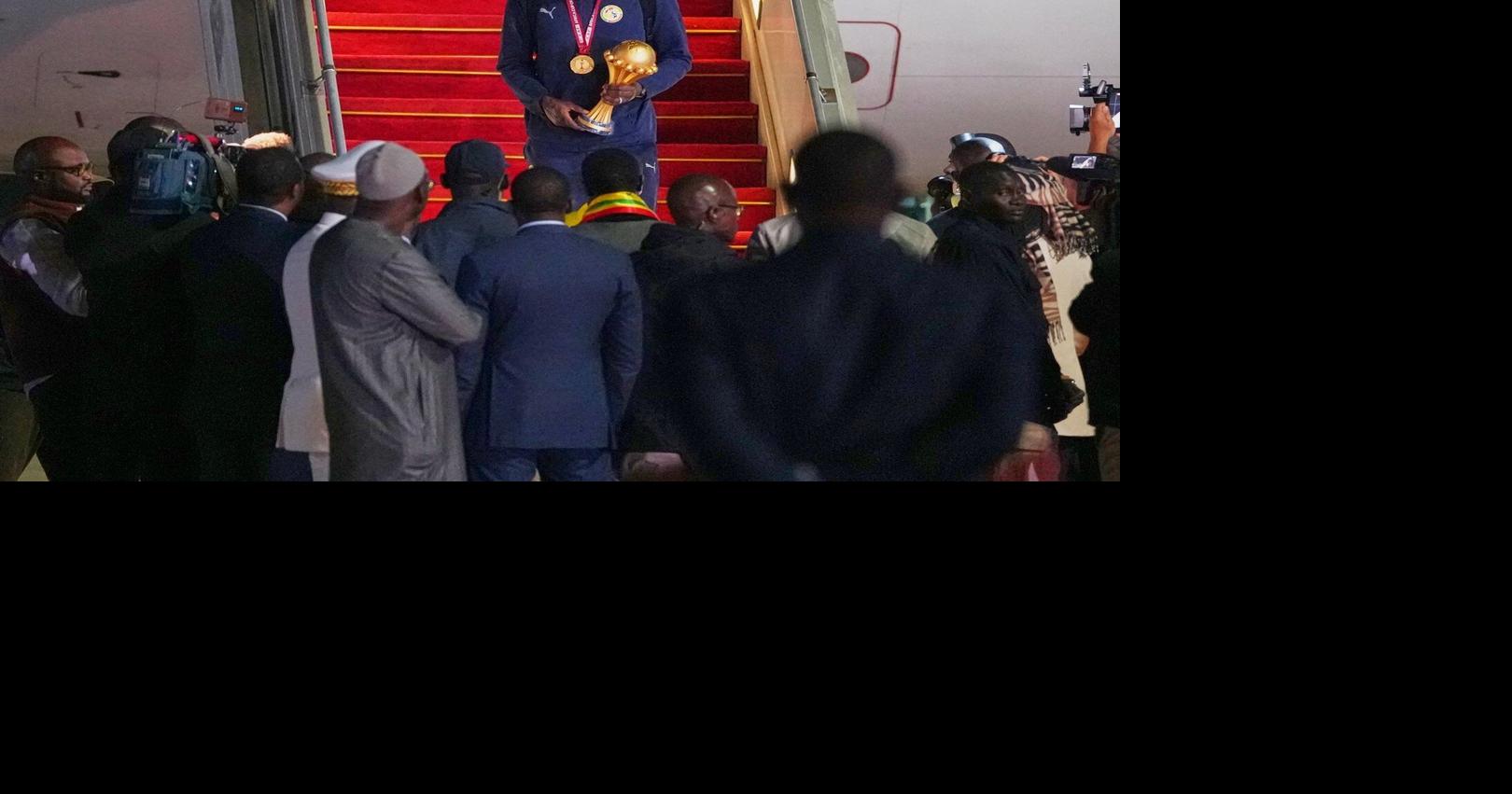 Senegal President greets team as triumphant players receive heroes welcome in Dakar