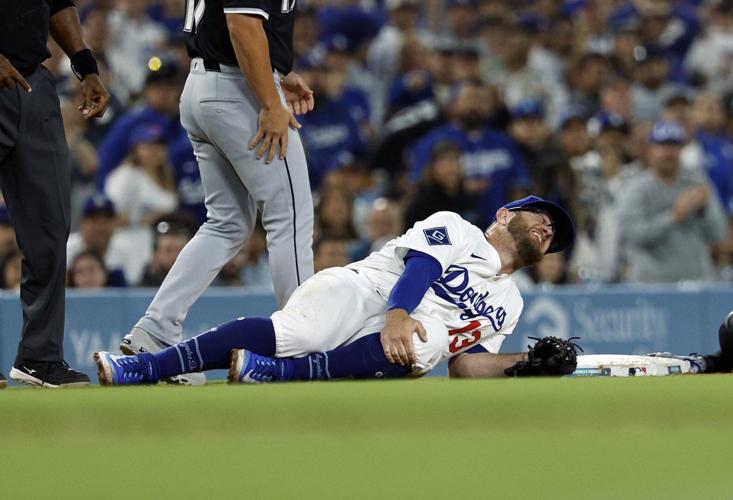 Dodgers' Muncy on injured list with knee bruise after collision with White Sox's Taylor