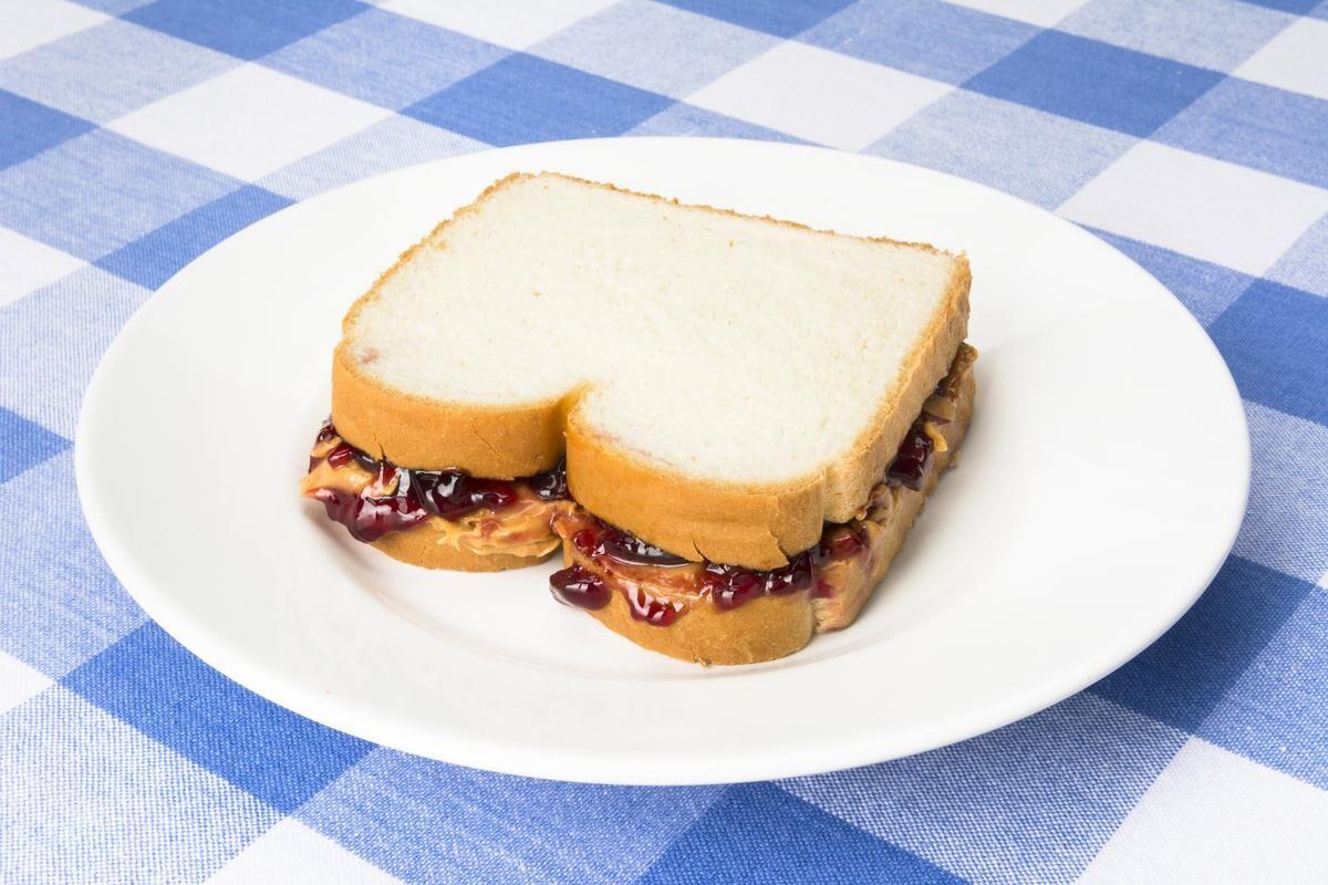 eating a peanut butter and jelly sandwich