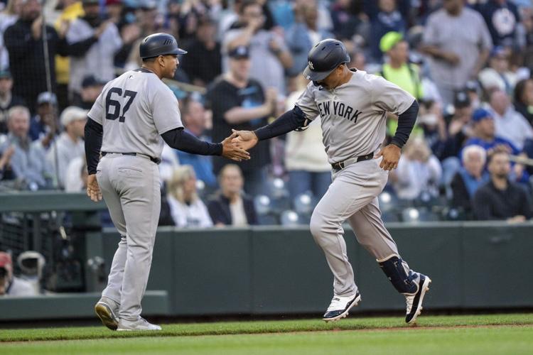 Grisham hits 2 homers to lead Yankees past Mariners 11-5, New York's Cabrera leaves in ambulance