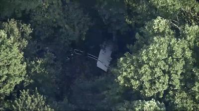 Skydiving plane goes off New Jersey runway and crashes into woods, sending 15 to hospital