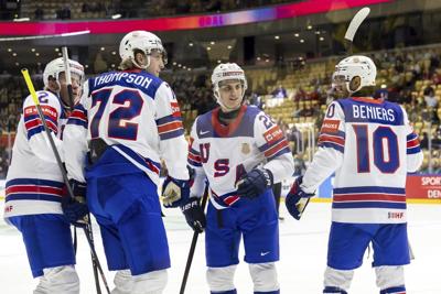 US scores 5 goals in middle period to rout Kazakhstan and advance at ice hockey worlds