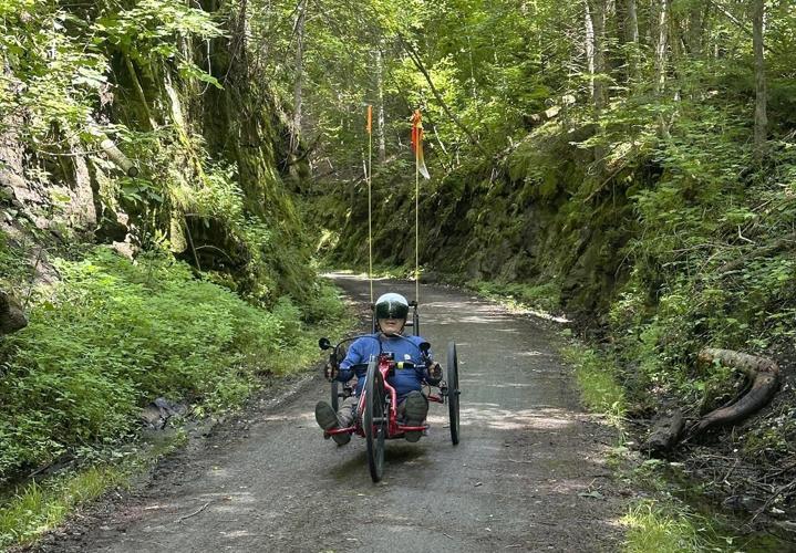 Hikers and cyclists can now cross Vermont on New England's longest rail trail, a year after floods