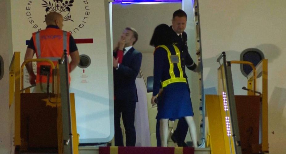 Macron says he and wife were horsing around when she appears to push the French leader
