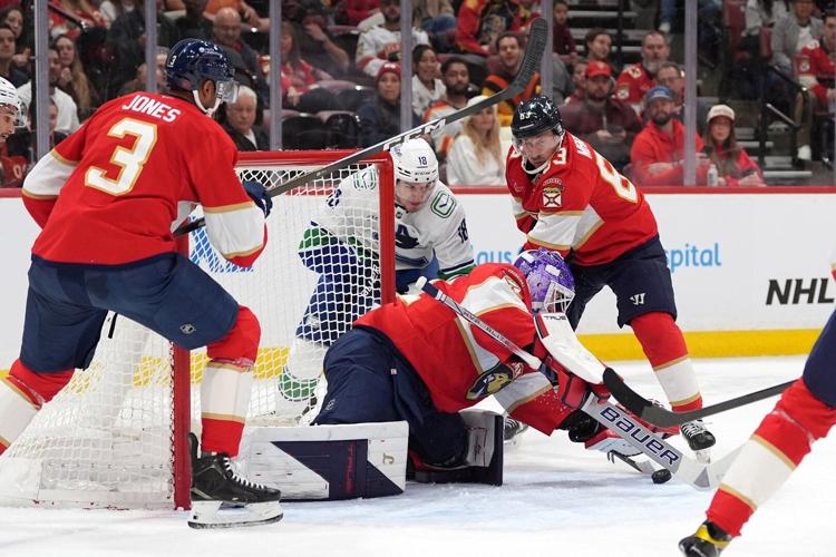 Bennett keys Panthers #39 three goal third period in 8 5 win over Canucks