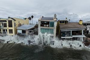 Using a drone, AP's Jae C. Hong frames Long Beach's waves crashing into oceanfront homes