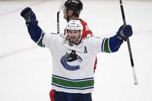 J.T. Miller scores in final seconds of OT, NHL-leading Canucks edge Capitals 3-2