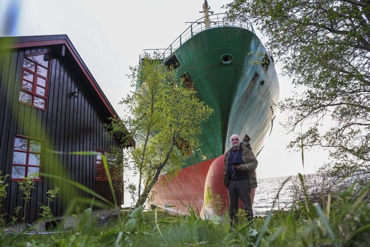 A Norwegian man awoke to find a grounded cargo ship had narrowly missed his home