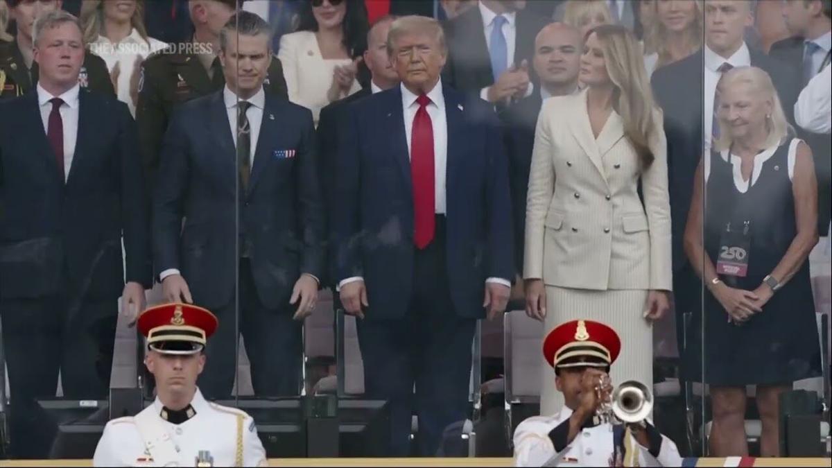 President Donald Trump arrives on stage for military parade