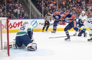 Oilers net first win with 3-1 decision over resilient Canucks