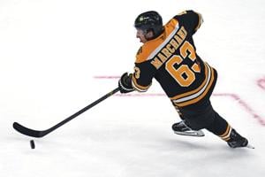 Bruins captain Brad Marchand departs with upper-body injury