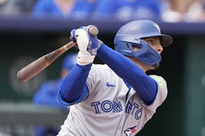 Blue Jays become first in AL to clinch playoff spot, beat Royals 8-5