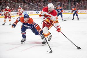 Kadri scores shootout winner, Flames rally for 4-3 season-opening win over Oilers