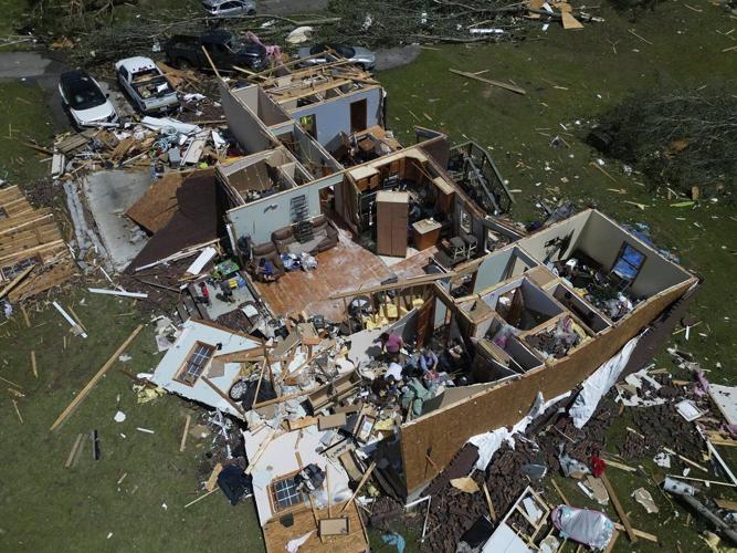 AP PHOTOS: Storm systems sweep across parts of the U.S. Midwest and South killing dozens